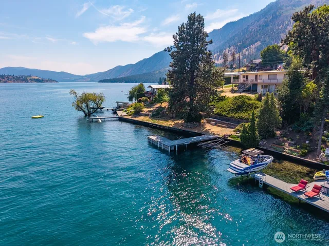 an aerial view of a house with outdoor space