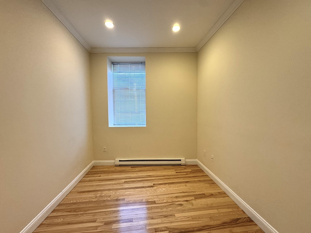3 Main Street, Unit 201 Peabody, MA 01960 - Photo 3 of 10 a view of a room with wooden floor