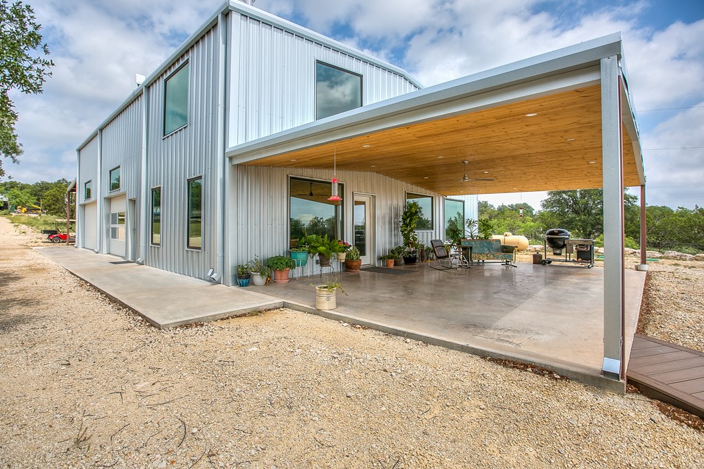 19621 Bluff Road Christoval, TX 76935 - Photo 3 of 74 a view of a patio with a table and chairs