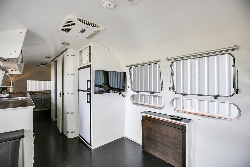 19621 Bluff Road Christoval, TX 76935 - Photo 47 of 74 a kitchen with cabinets and stainless steel appliances