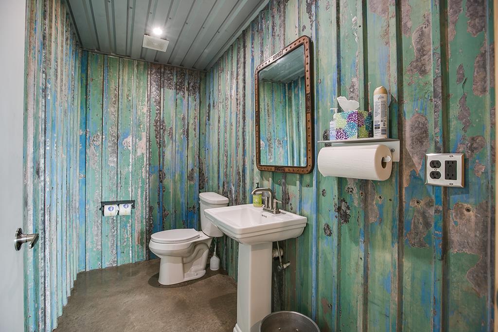 19621 Bluff Road Christoval, TX 76935 - Photo 58 of 74 a bathroom with a toilet sink and shower curtain