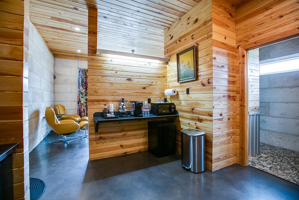 19621 Bluff Road Christoval, TX 76935 - Photo 73 of 74 a kitchen with stainless steel appliances granite countertop a stove and a wooden cabinets