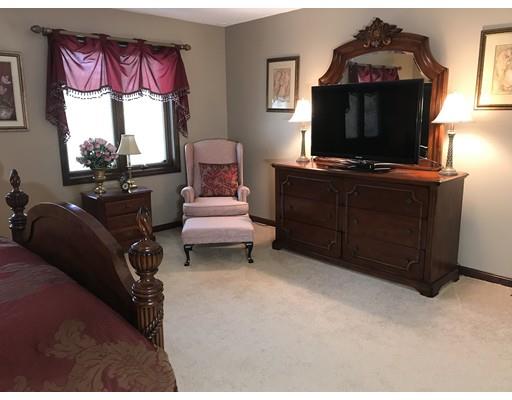 11 Dotys Mill Road Acushnet, MA 02743 - Photo 11 of 26 a living room with furniture a flat screen tv and a fireplace