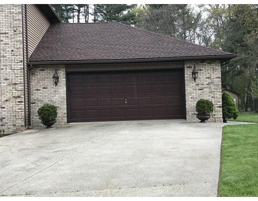 11 Dotys Mill Road Acushnet, MA 02743 - Photo 2 of 26 a front view of a house with a yard and garage