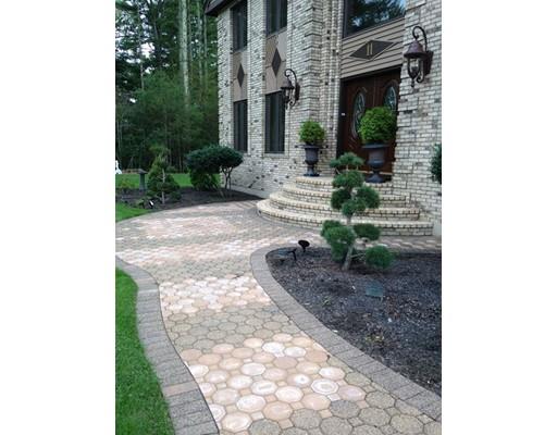 11 Dotys Mill Road Acushnet, MA 02743 - Photo 3 of 26 a view of a pathway that has large trees and plants