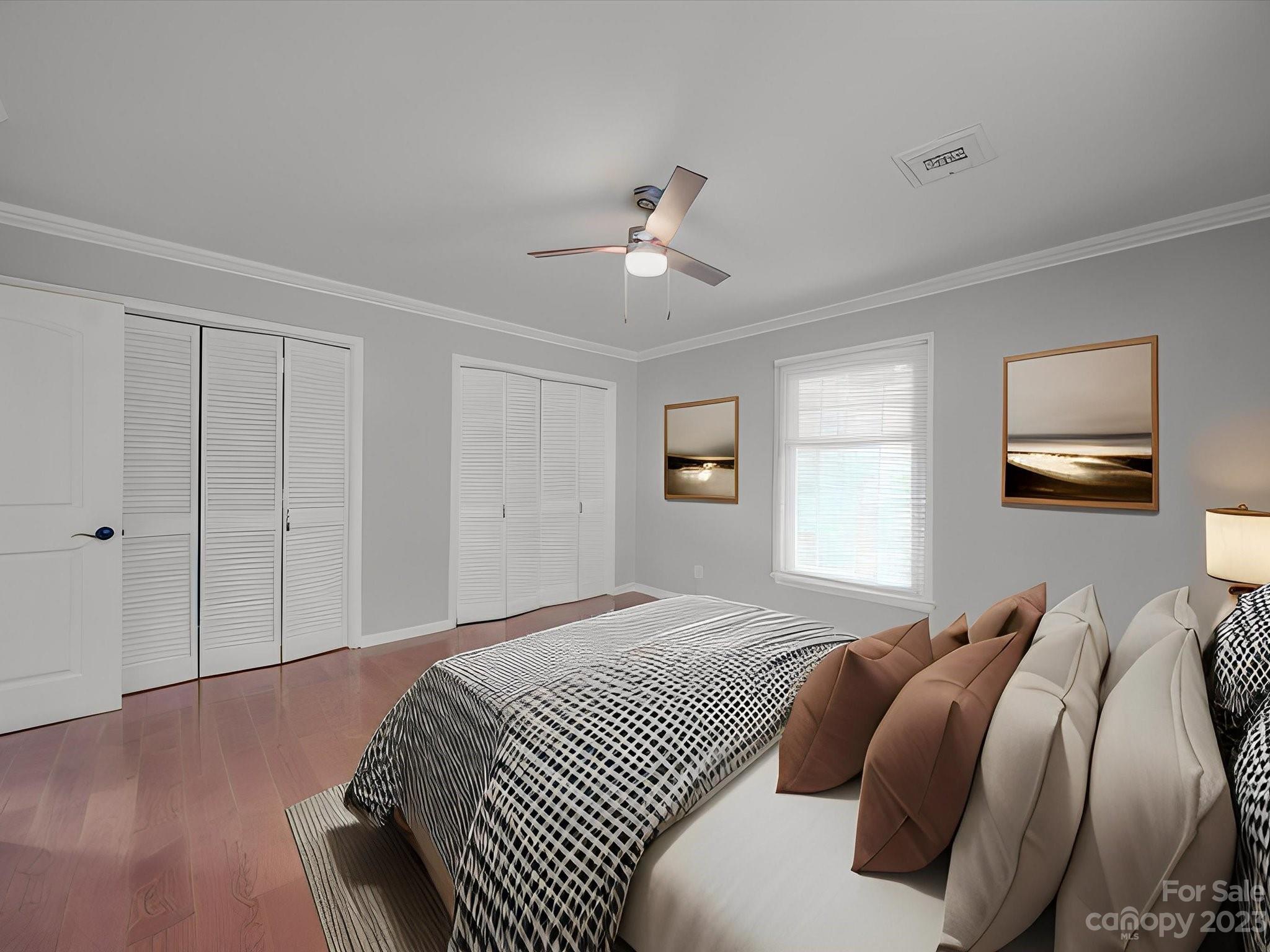 1035 Blake Road Albemarle, NC 28001 - Photo 16 of 45 a bedroom with a bed and a chandelier