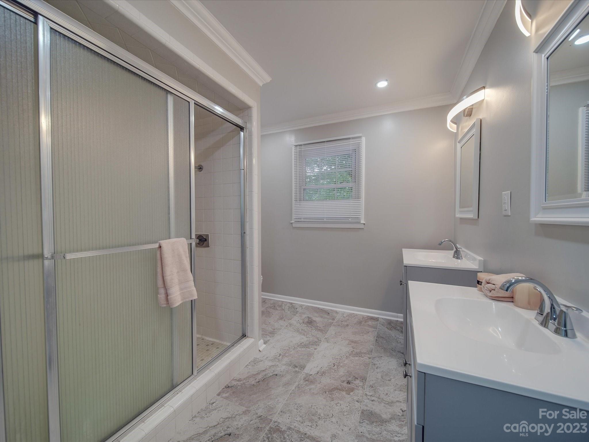 1035 Blake Road Albemarle, NC 28001 - Photo 19 of 45 a bathroom with a sink and mirror