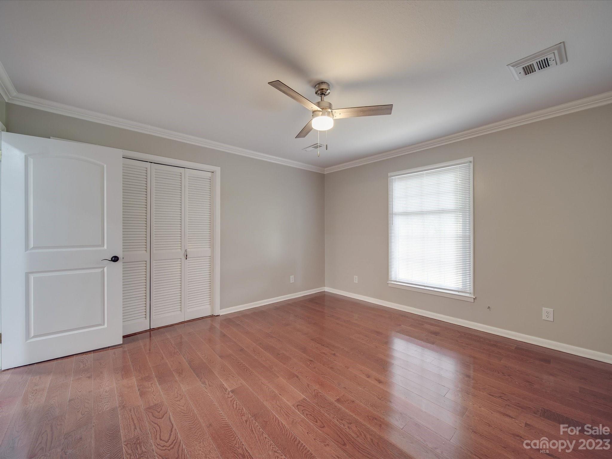 1035 Blake Road Albemarle, NC 28001 - Photo 22 of 45 a view of empty room with wooden floor and fan