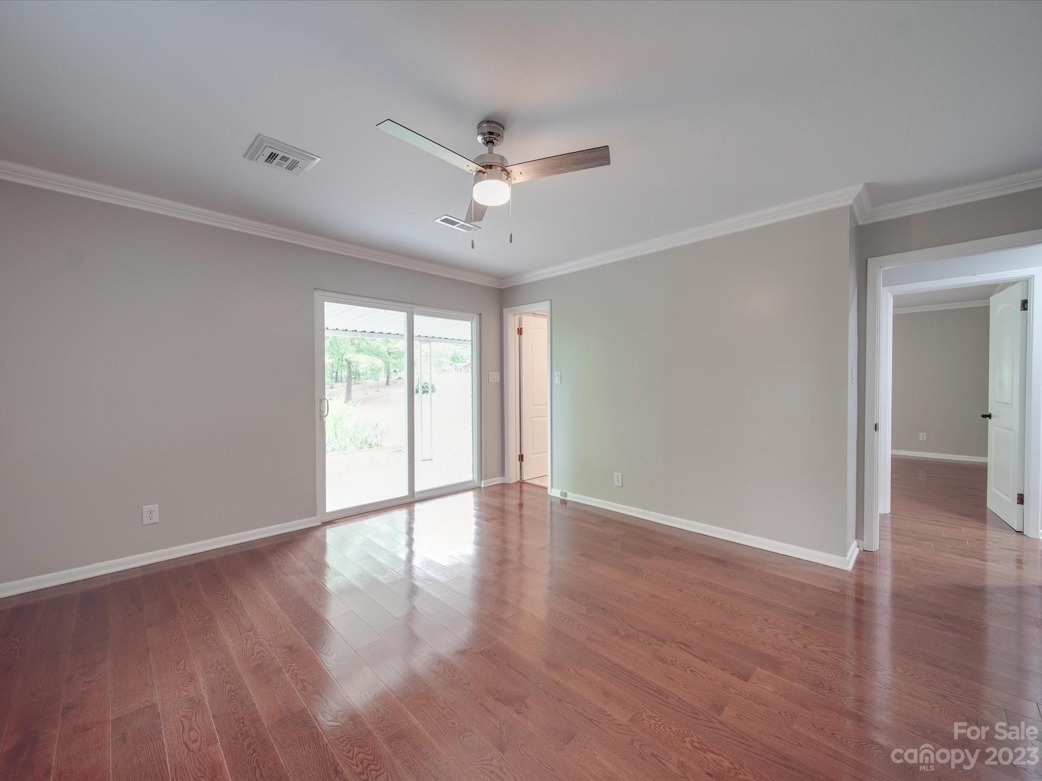 1035 Blake Road Albemarle, NC 28001 - Photo 25 of 45 a view of an empty room with wooden floor and a window