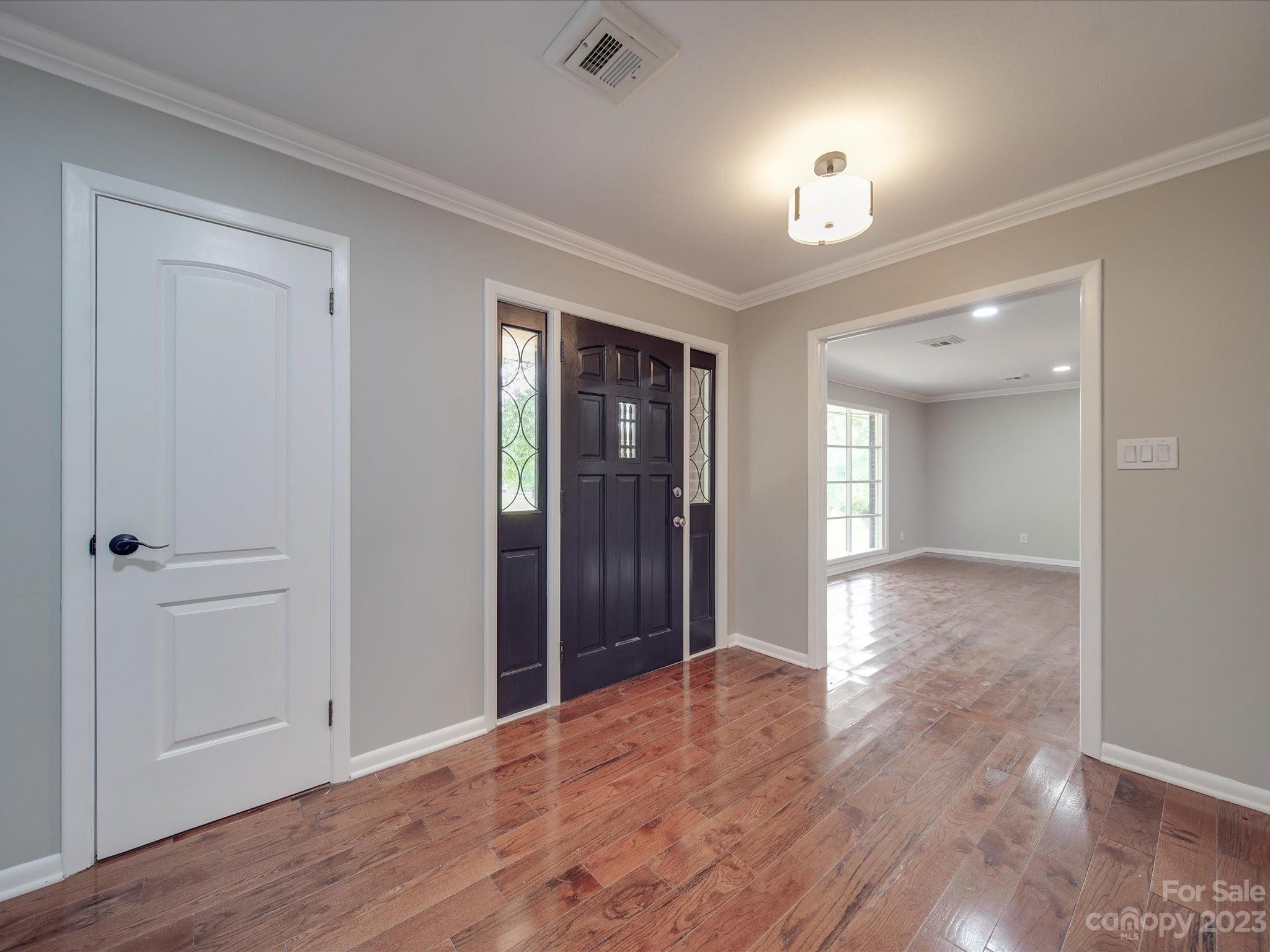 1035 Blake Road Albemarle, NC 28001 - Photo 3 of 45 wooden floor in an empty room with a window
