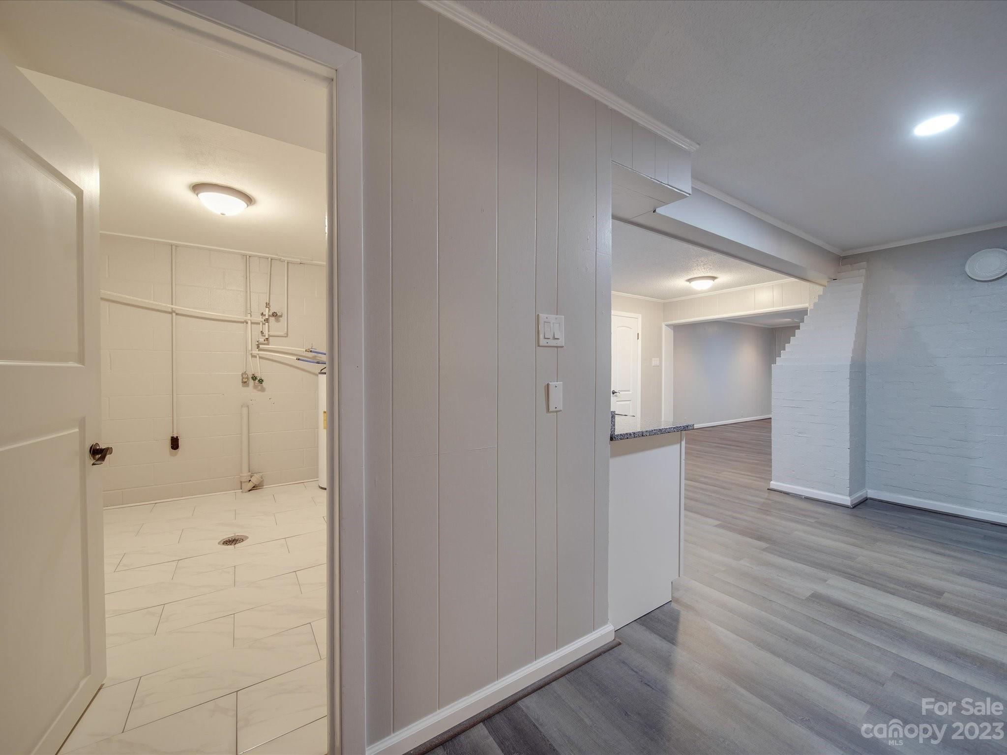1035 Blake Road Albemarle, NC 28001 - Photo 34 of 45 a view of a hallway with wooden floor
