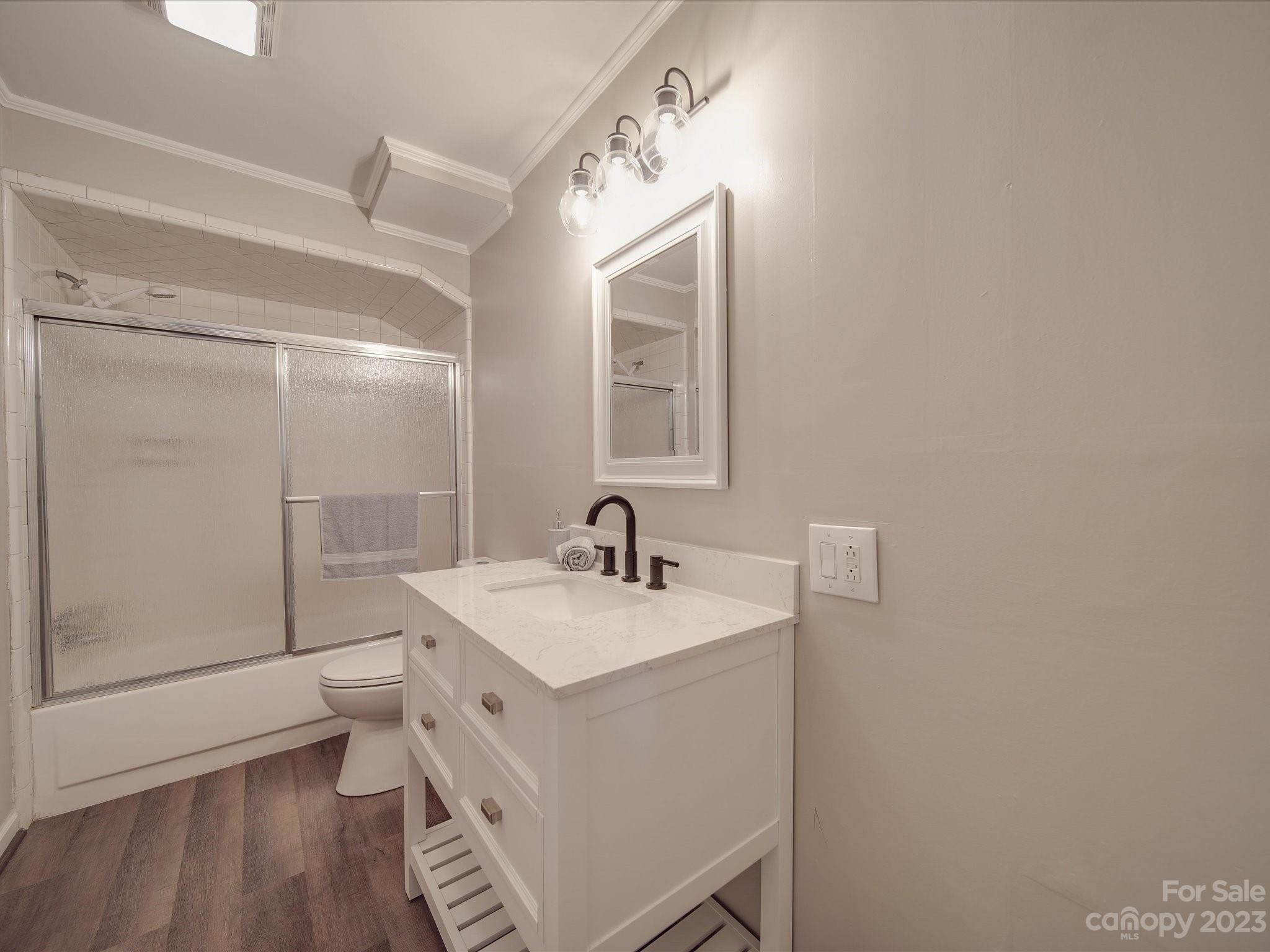 1035 Blake Road Albemarle, NC 28001 - Photo 35 of 45 a bathroom with a sink a toilet and shower
