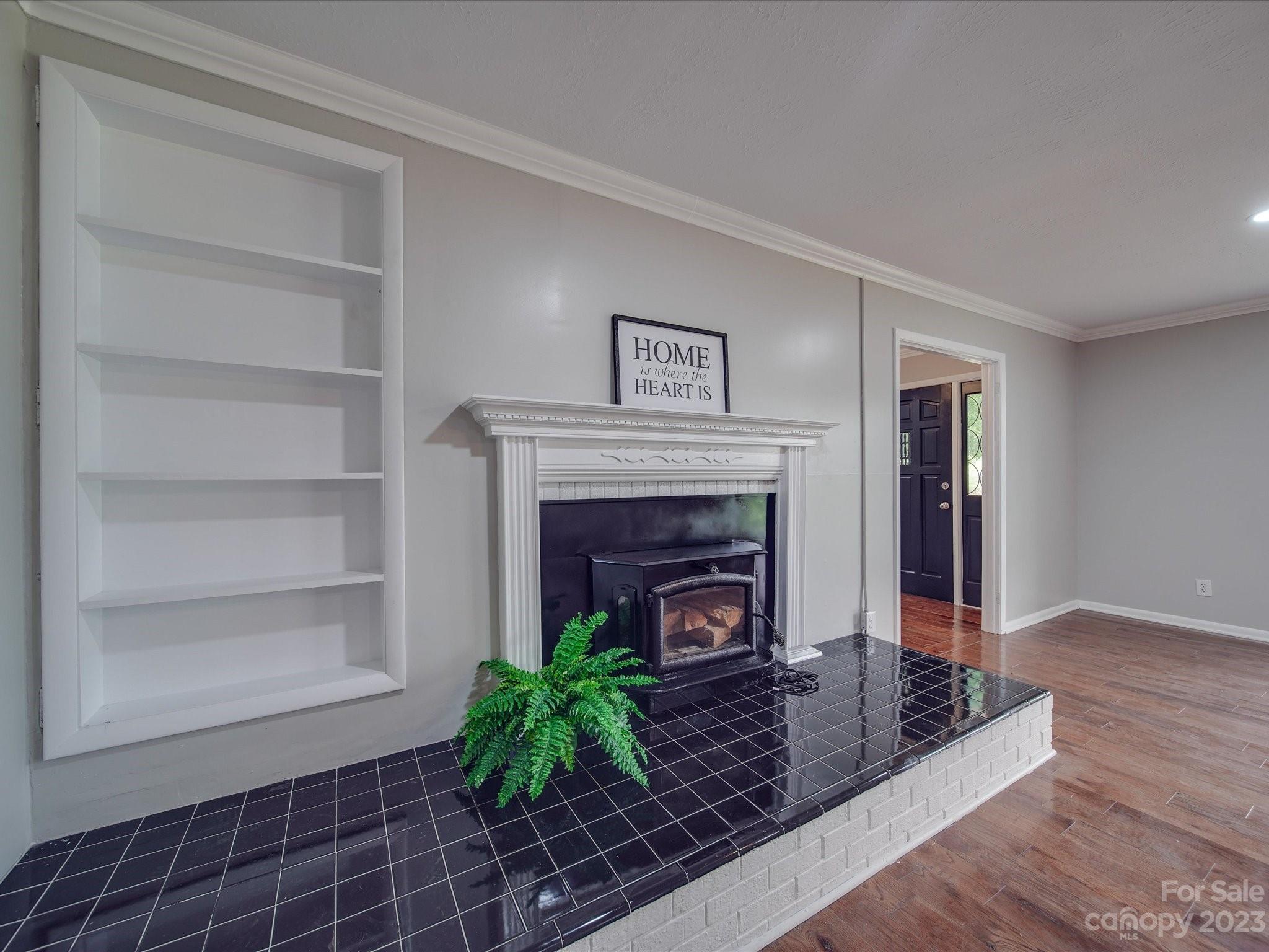 1035 Blake Road Albemarle, NC 28001 - Photo 4 of 45 a living room with furniture and a fireplace