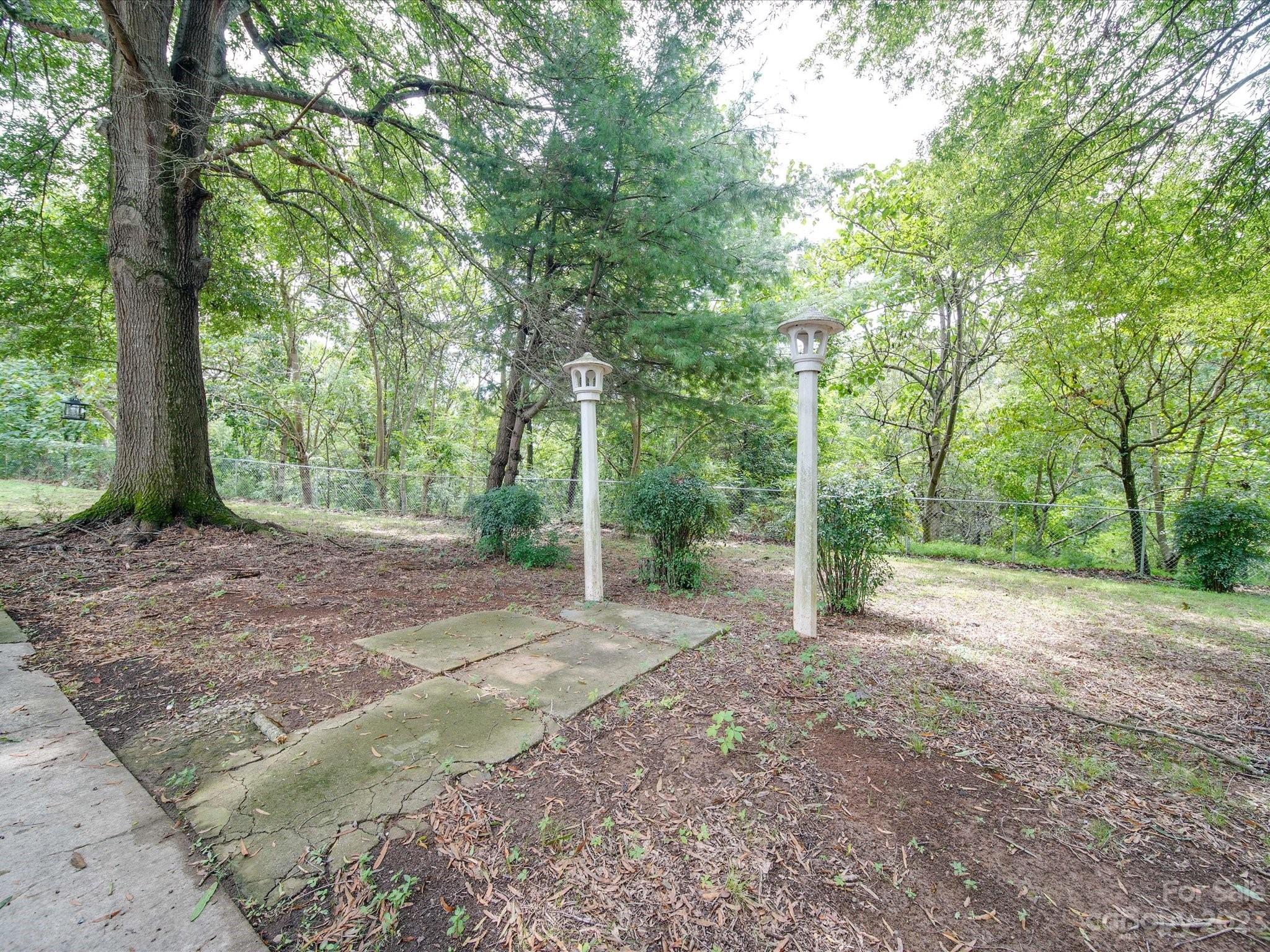 1035 Blake Road Albemarle, NC 28001 - Photo 42 of 45 a view of a yard with large trees
