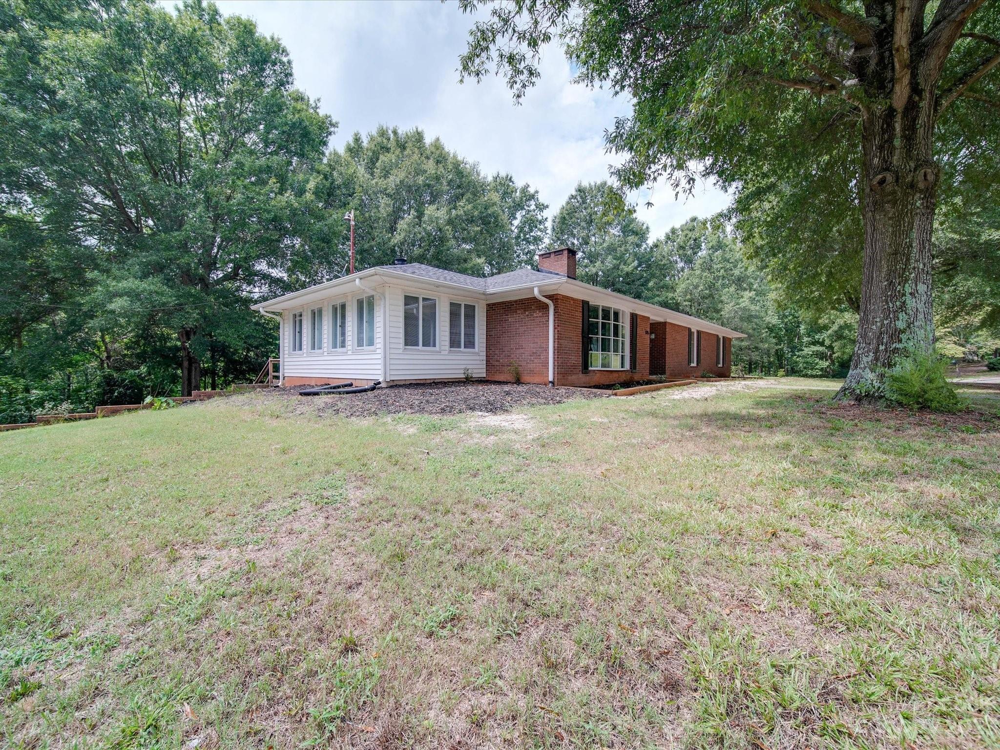 1035 Blake Road Albemarle, NC 28001 - Photo 43 of 45 a view of a house with a yard and sitting area