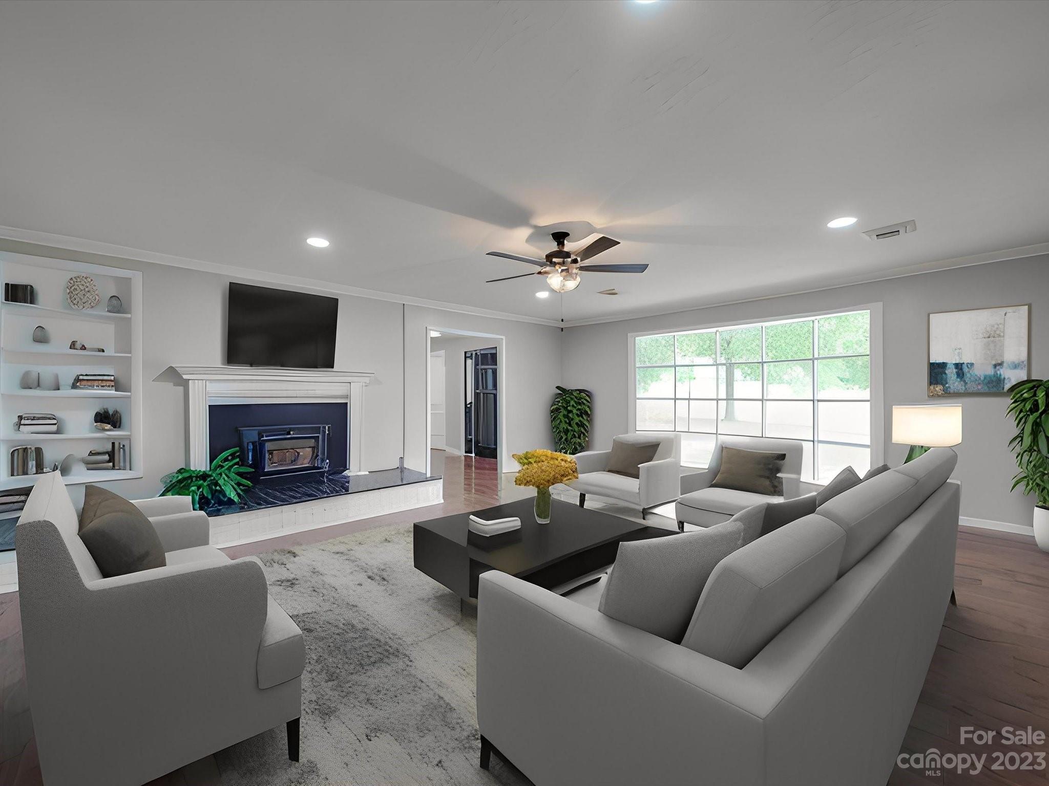 1035 Blake Road Albemarle, NC 28001 - Photo 5 of 45 a living room with furniture a fireplace and a flat screen tv