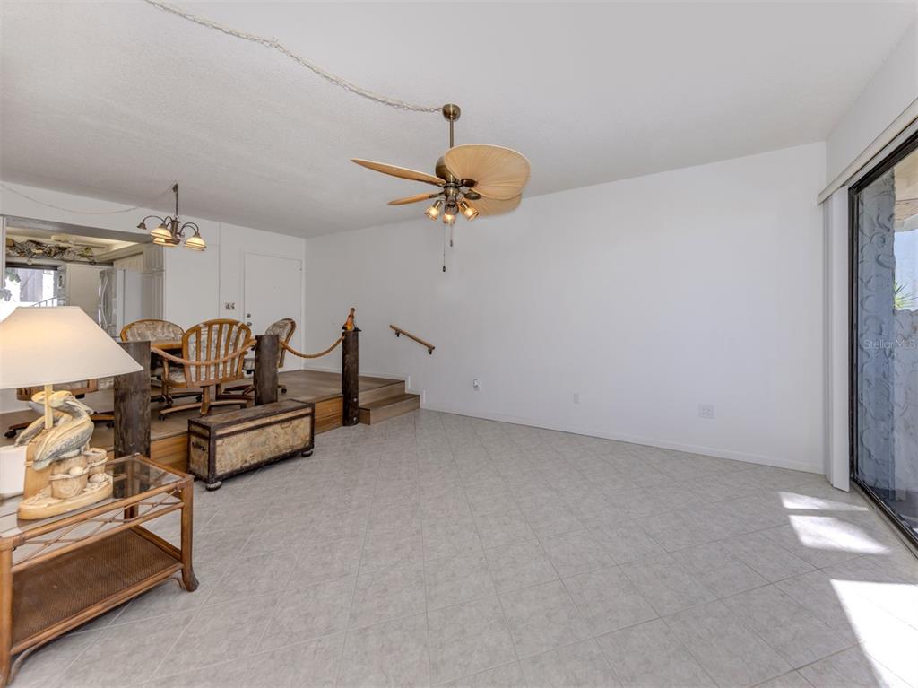 1555 Tarpon Center Drive, Unit 132 Venice, FL 34285 - Photo 14 of 58 a living room with furniture