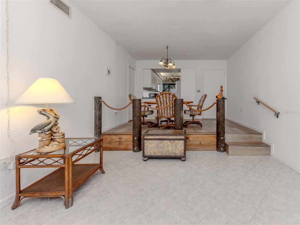 1555 Tarpon Center Drive, Unit 132 Venice, FL 34285 - Photo 9 of 58 a living room with furniture