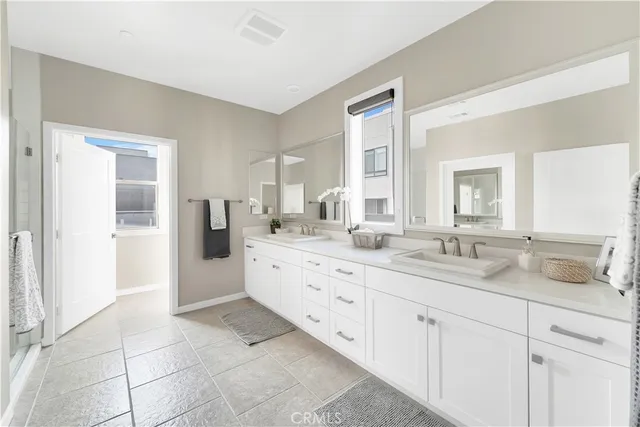 a bathroom with a granite countertop sink mirror and