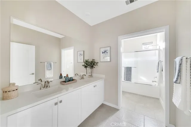 a bathroom with a sink a vanity and a mirror