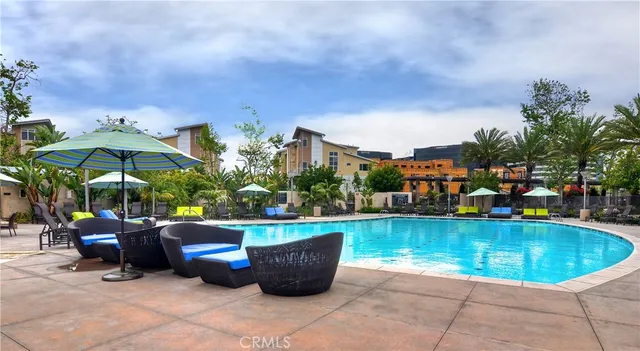 a view of a swimming pool with sitting area