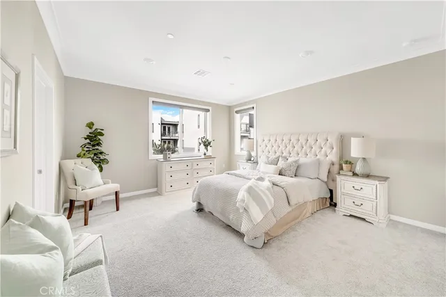 a bed room with a bed and a chair