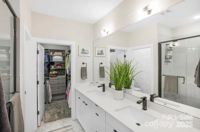a white toilet sitting next to a bathroom sink