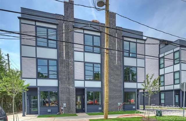 a view of a building with a tree