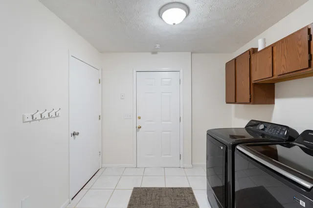 a view of a kitchen with electric appliances
