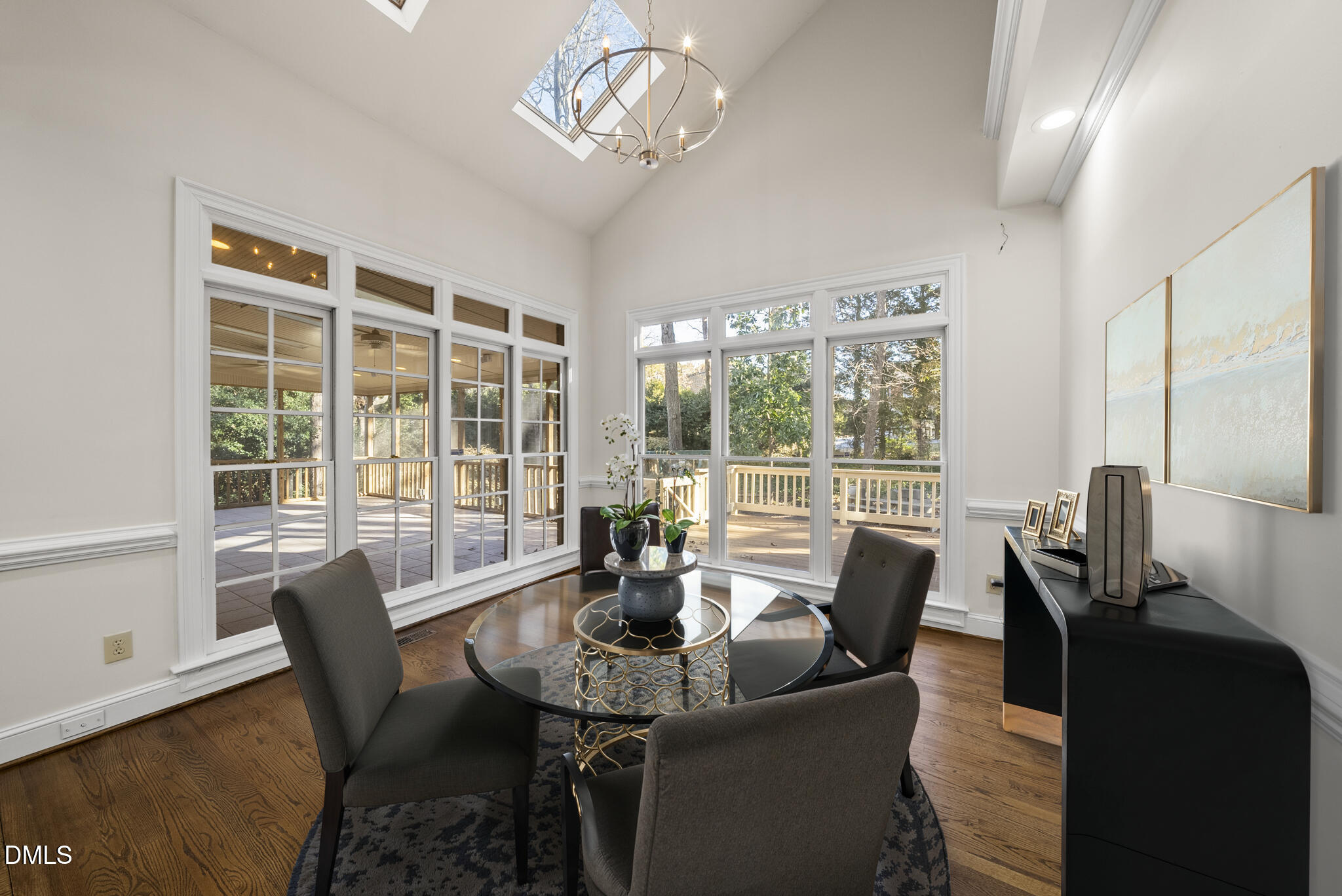 3812 City Of Oaks Wynd Raleigh, NC 27612 - Photo 10 of 79 a view of a dining room with furniture wooden floor and a chandelier