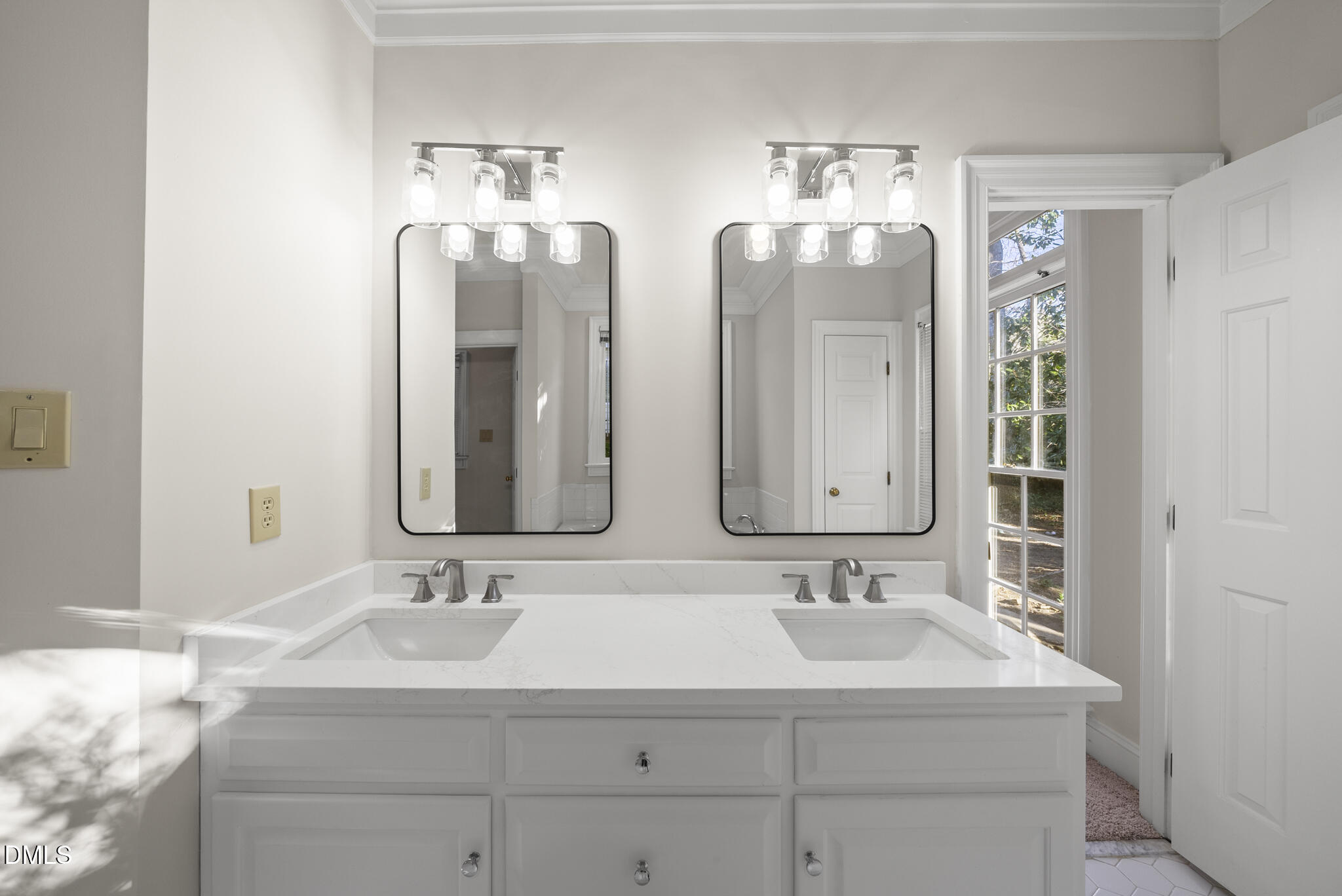 3812 City Of Oaks Wynd Raleigh, NC 27612 - Photo 12 of 79 a bathroom with double vanity sinks and a mirror