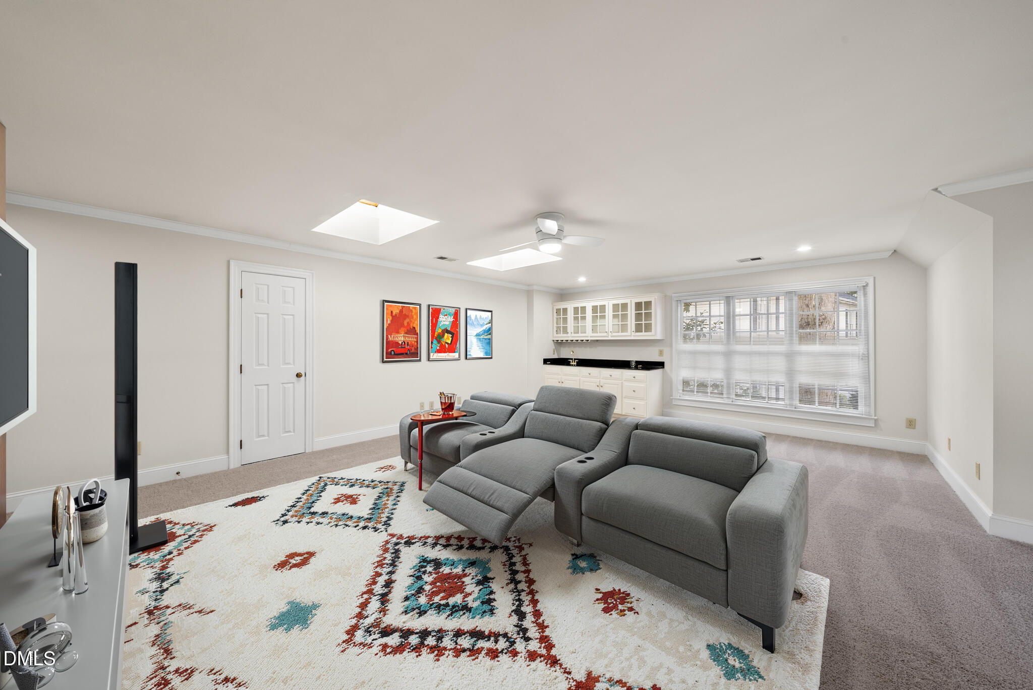 3812 City Of Oaks Wynd Raleigh, NC 27612 - Photo 21 of 79 a living room with furniture and a book shelf