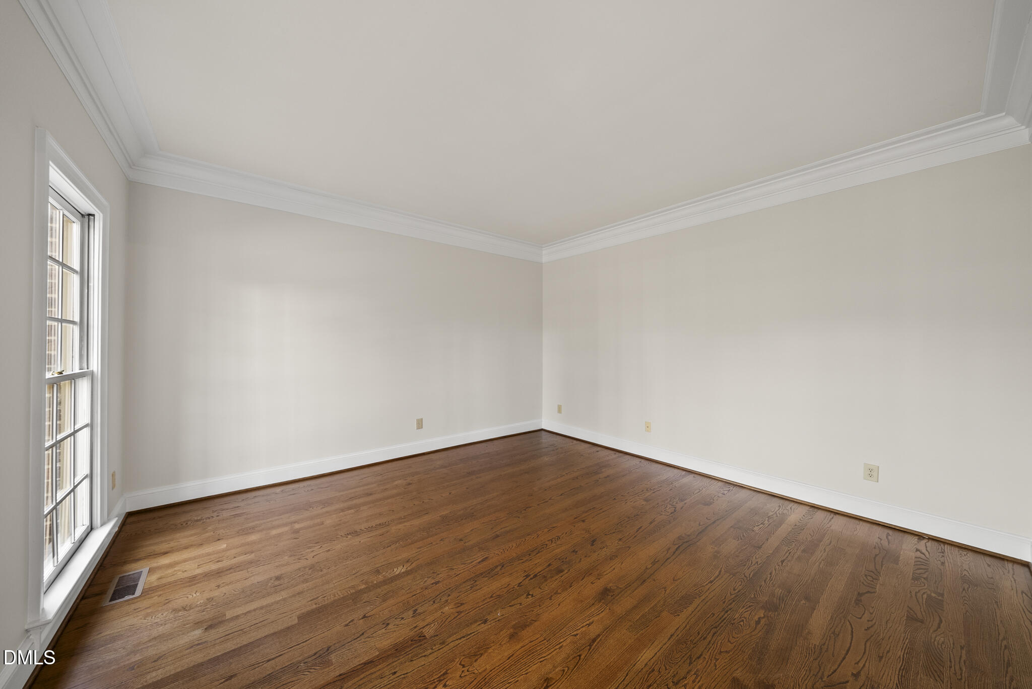 3812 City Of Oaks Wynd Raleigh, NC 27612 - Photo 23 of 79 an empty room with wooden floor and windows