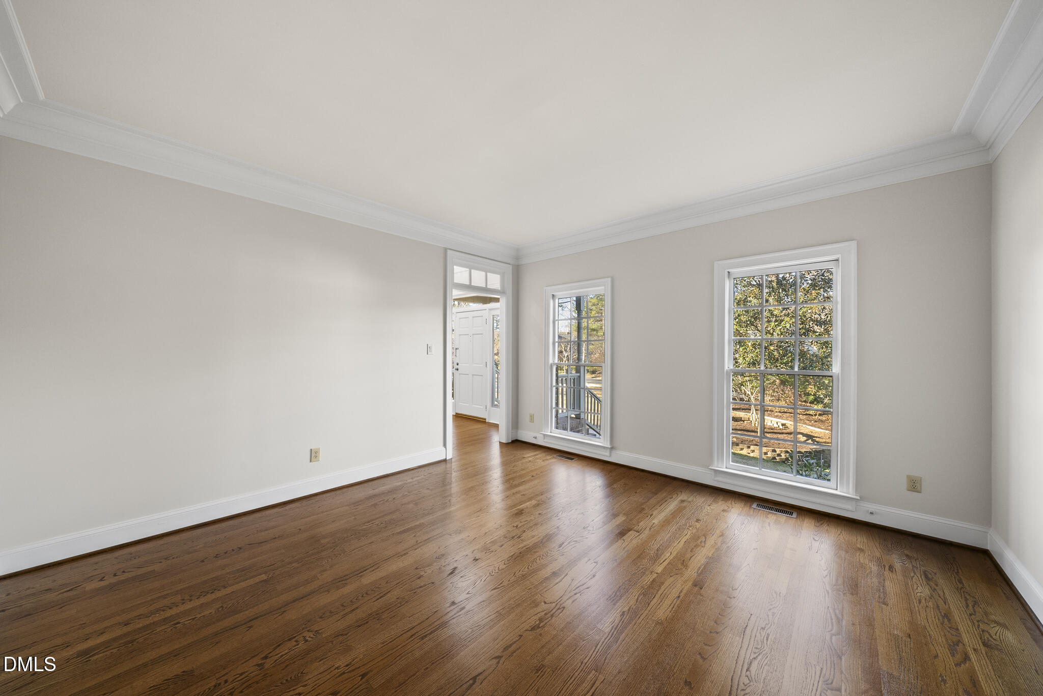 3812 City Of Oaks Wynd Raleigh, NC 27612 - Photo 24 of 79 a view of an empty room with wooden floor and a window