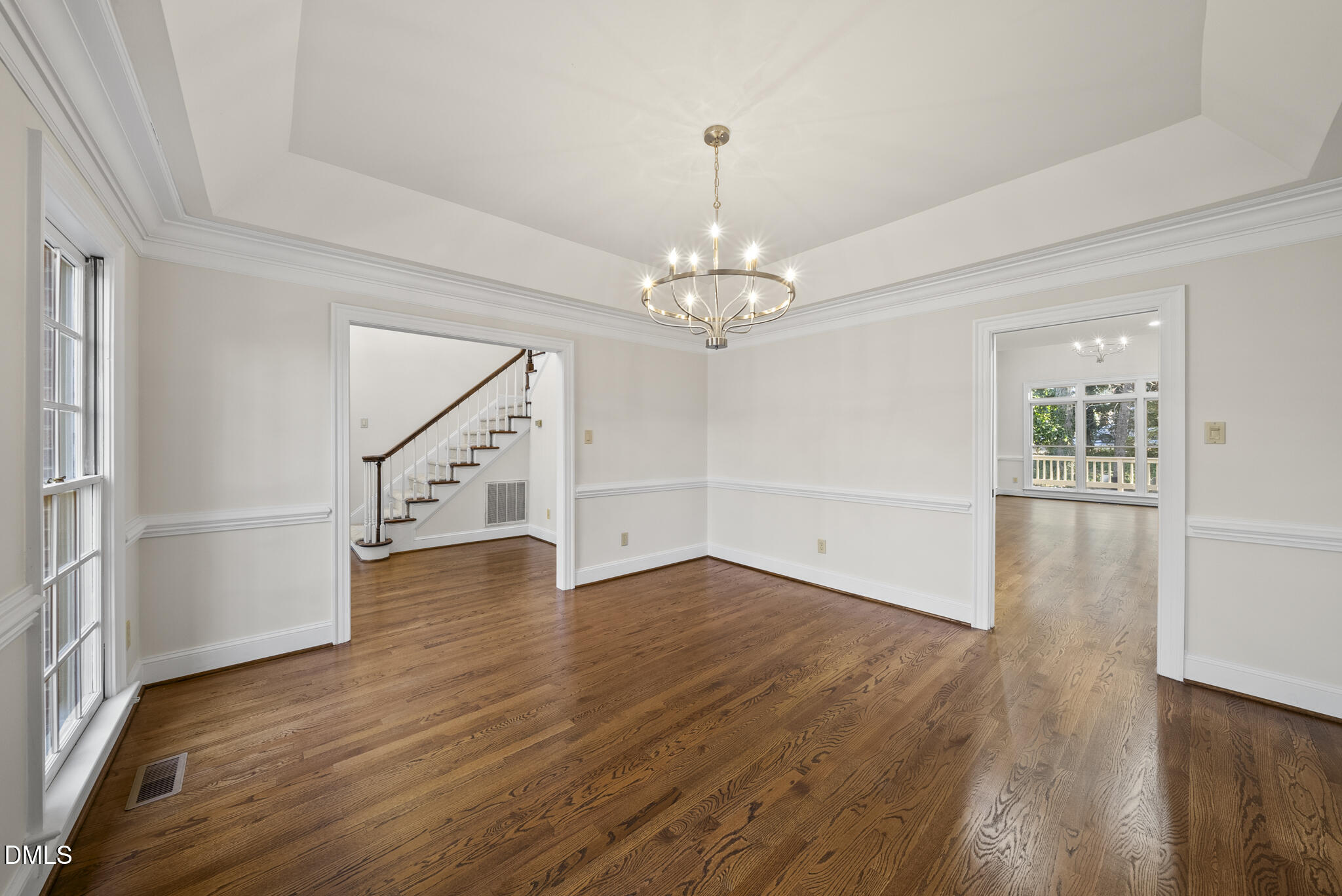 3812 City Of Oaks Wynd Raleigh, NC 27612 - Photo 25 of 79 wooden floor in an empty room with a window