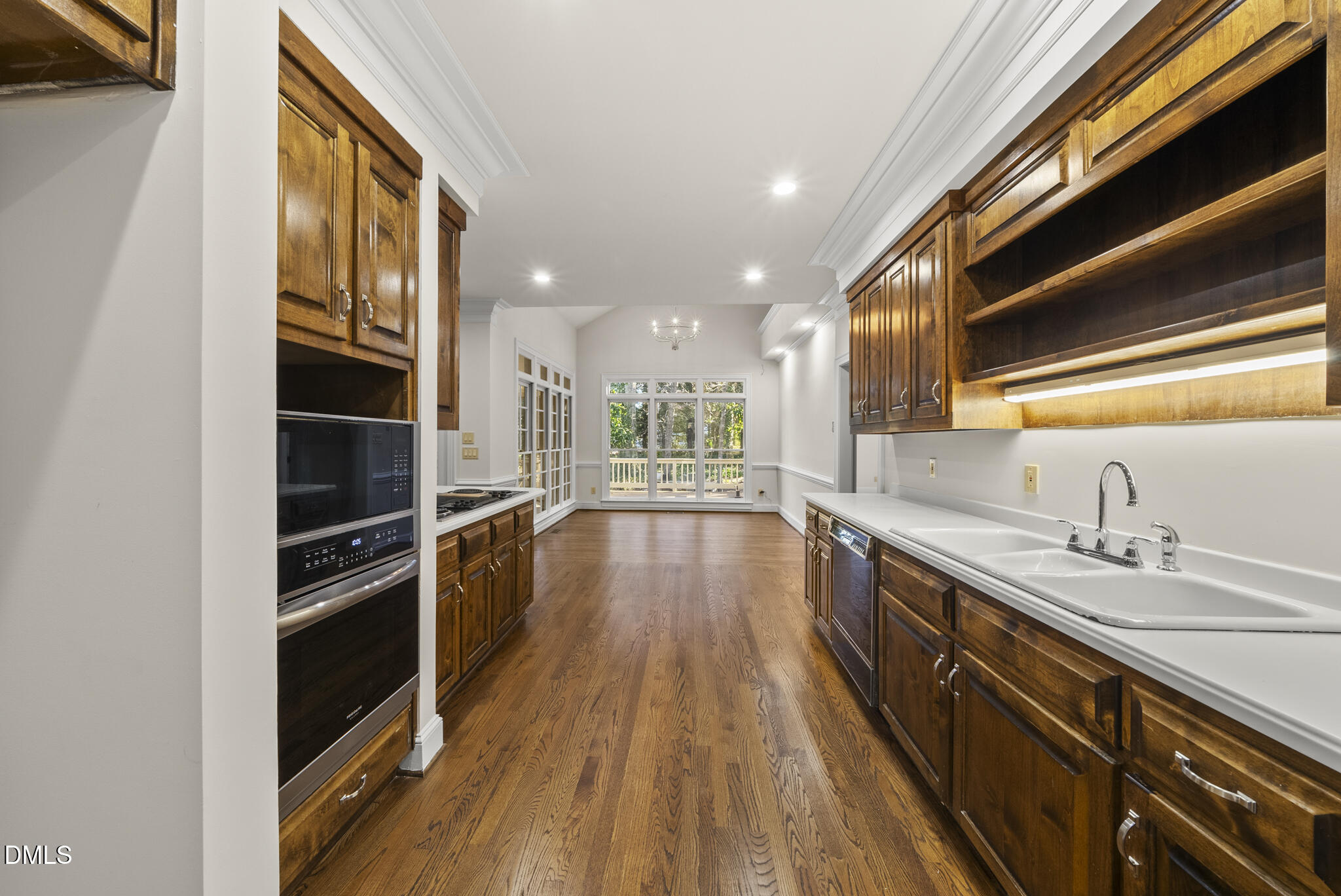 3812 City Of Oaks Wynd Raleigh, NC 27612 - Photo 26 of 79 a view of a kitchen with wooden floor and a sink