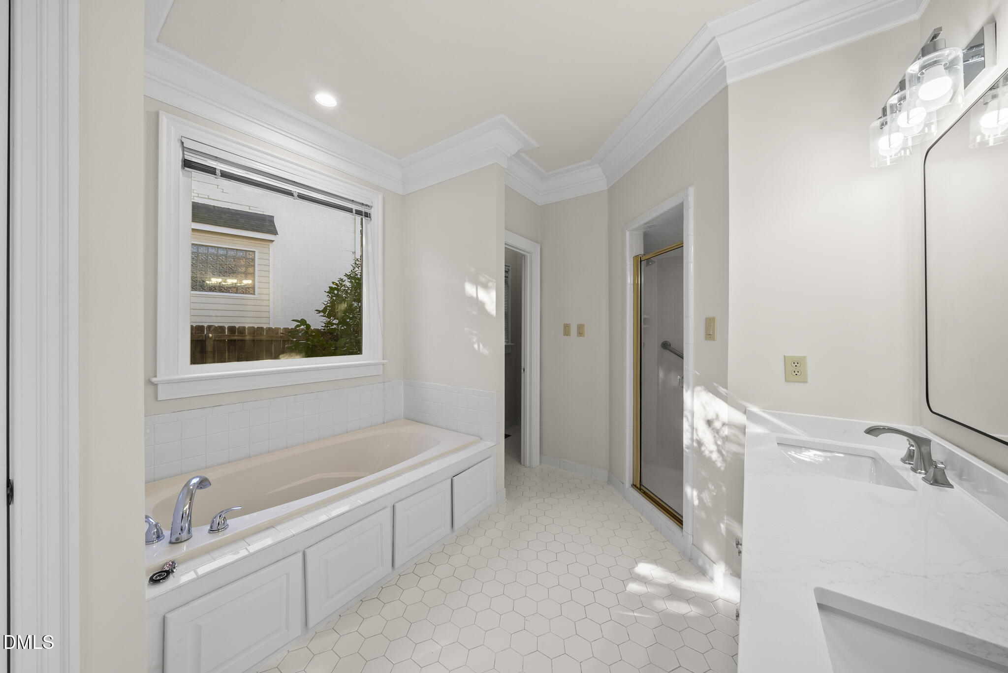 3812 City Of Oaks Wynd Raleigh, NC 27612 - Photo 43 of 79 a bathroom with a tub sink and mirror