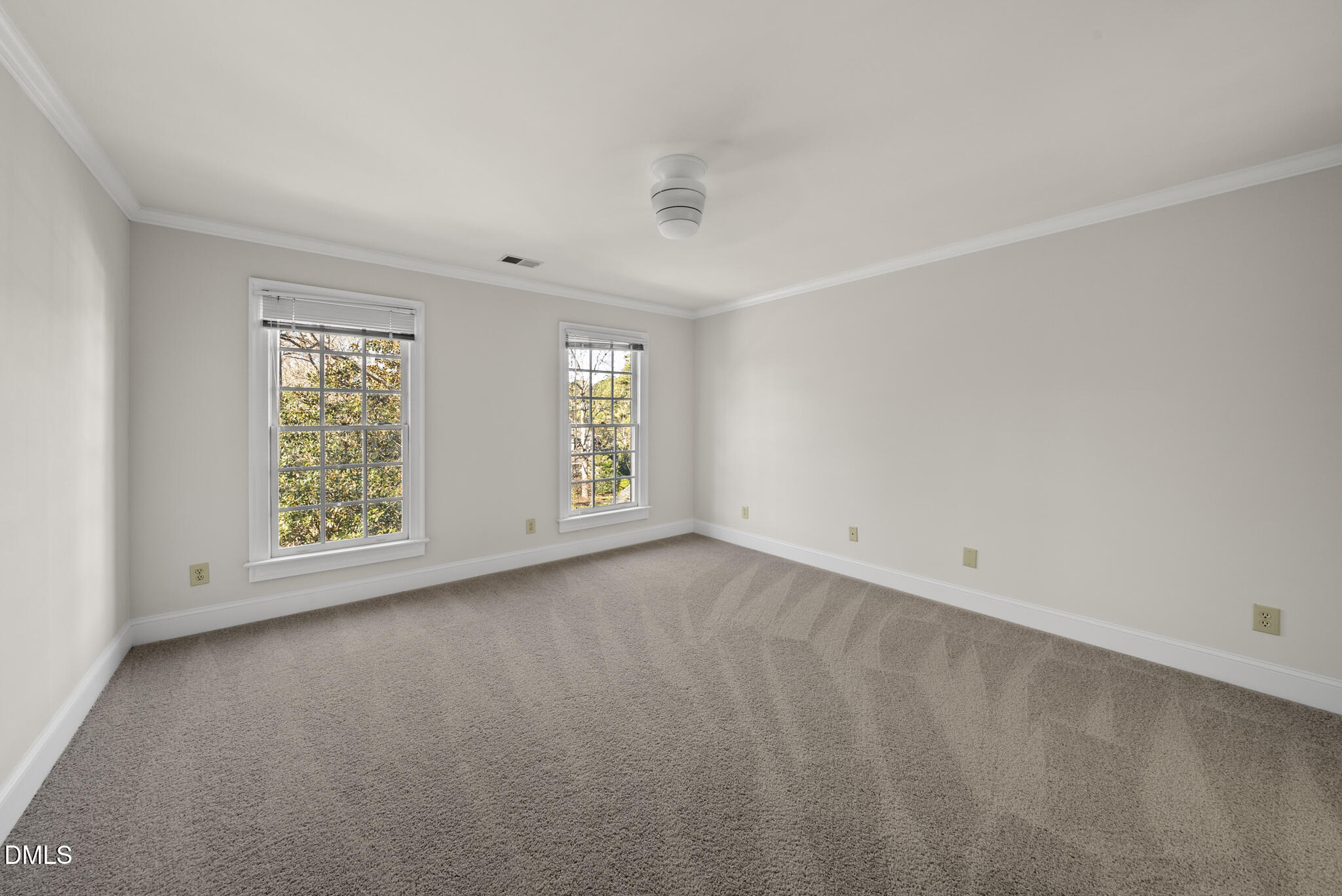 3812 City Of Oaks Wynd Raleigh, NC 27612 - Photo 63 of 79 an empty room with windows