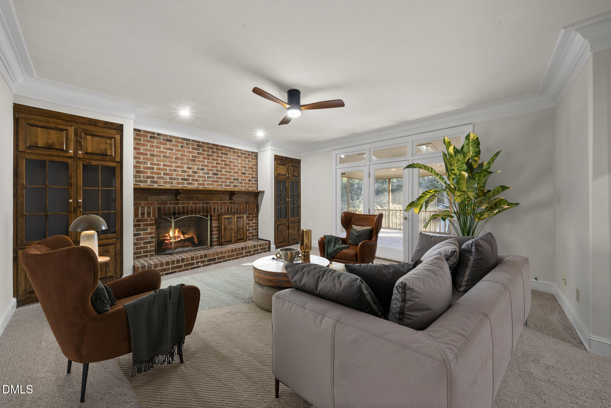 3812 City Of Oaks Wynd Raleigh, NC 27612 - Photo 9 of 79 a living room with furniture a fireplace and a ceiling fan