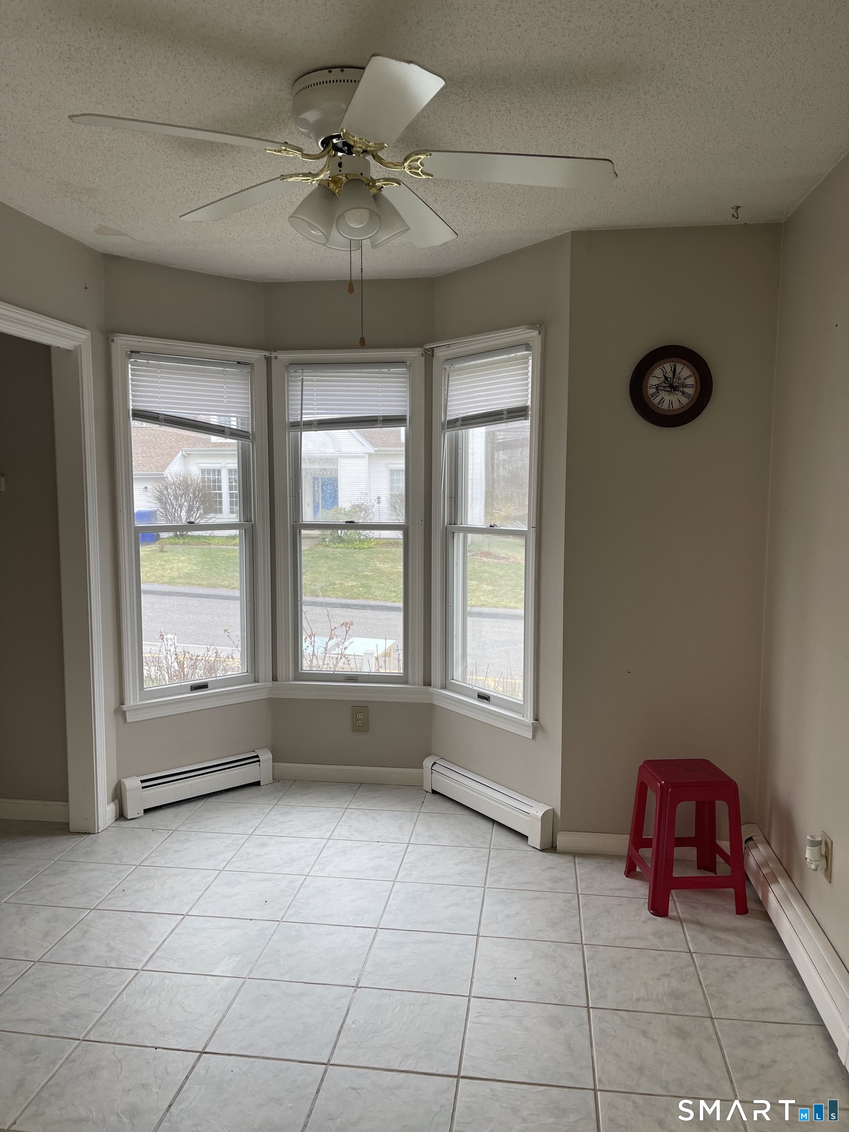 163 Trotters Way Torrington, CT 06790 - Photo 11 of 23 an empty room with windows and fan