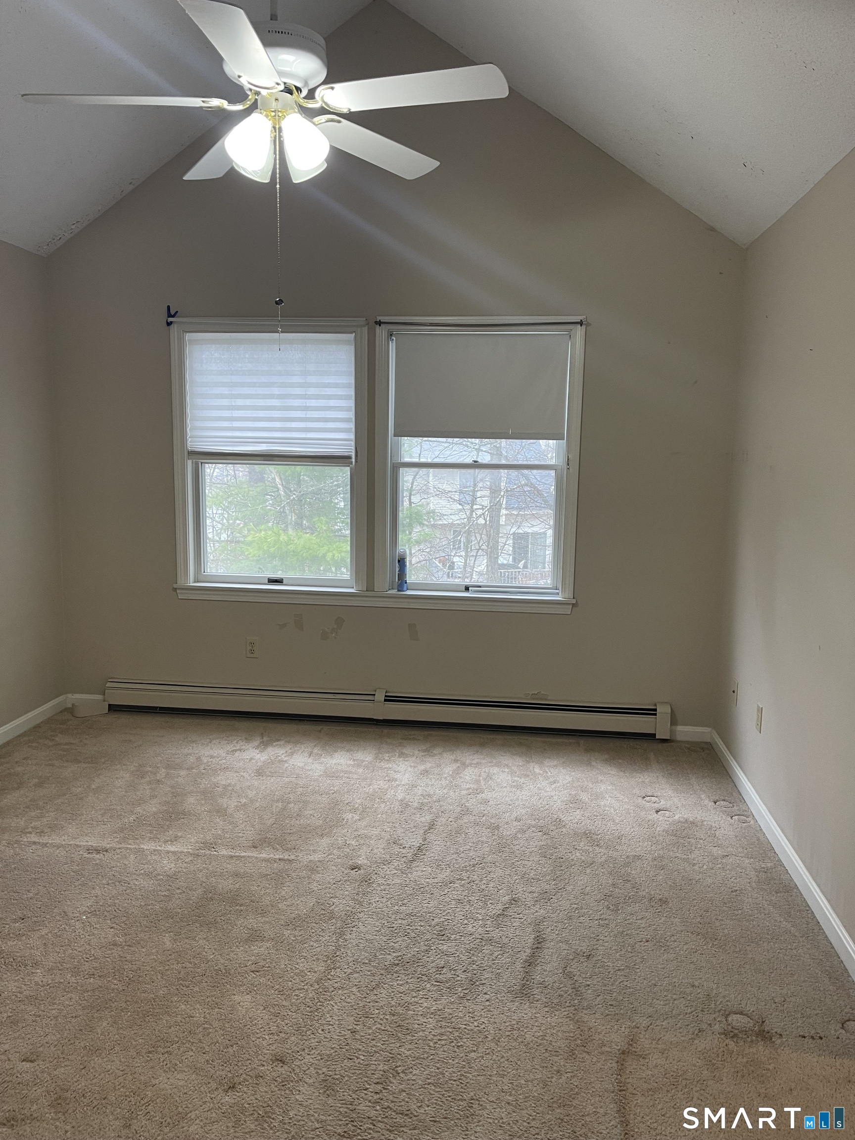163 Trotters Way Torrington, CT 06790 - Photo 9 of 23 an empty room with a chandelier fan and windows