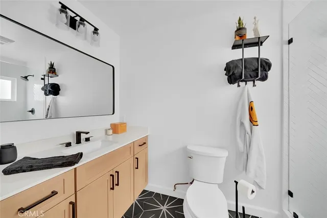 a bathroom with a shower and a toilet