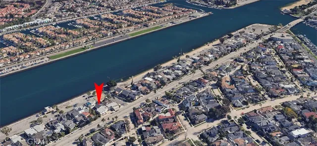 a view of a white house with large windows