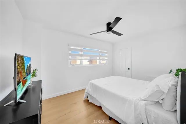 a bed room with a bed and a window