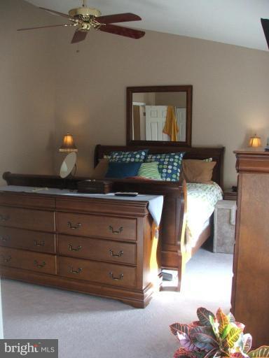 9537 Hallhurst Road Nottingham, MD 21236 - Photo 14 of 14 a bedroom with a bed and a chandelier