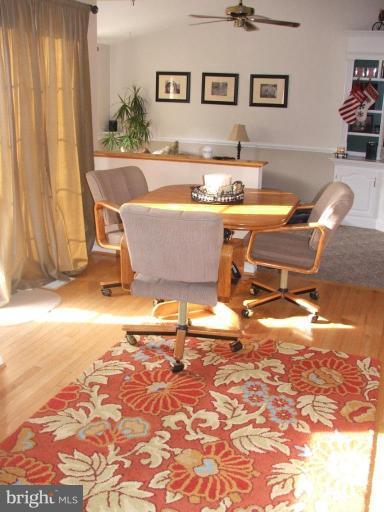 9537 Hallhurst Road Nottingham, MD 21236 - Photo 3 of 14 a living room with a rug floor and a table