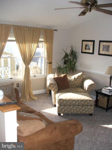 9537 Hallhurst Road Nottingham, MD 21236 - Photo 5 of 14 a living room with furniture and a large window