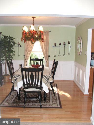 9537 Hallhurst Road Nottingham, MD 21236 - Photo 6 of 14 a view of a dining room with furniture window and wooden floor
