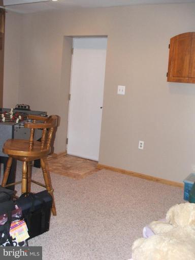 9537 Hallhurst Road Nottingham, MD 21236 - Photo 9 of 14 a view of workspace room with wooden floor