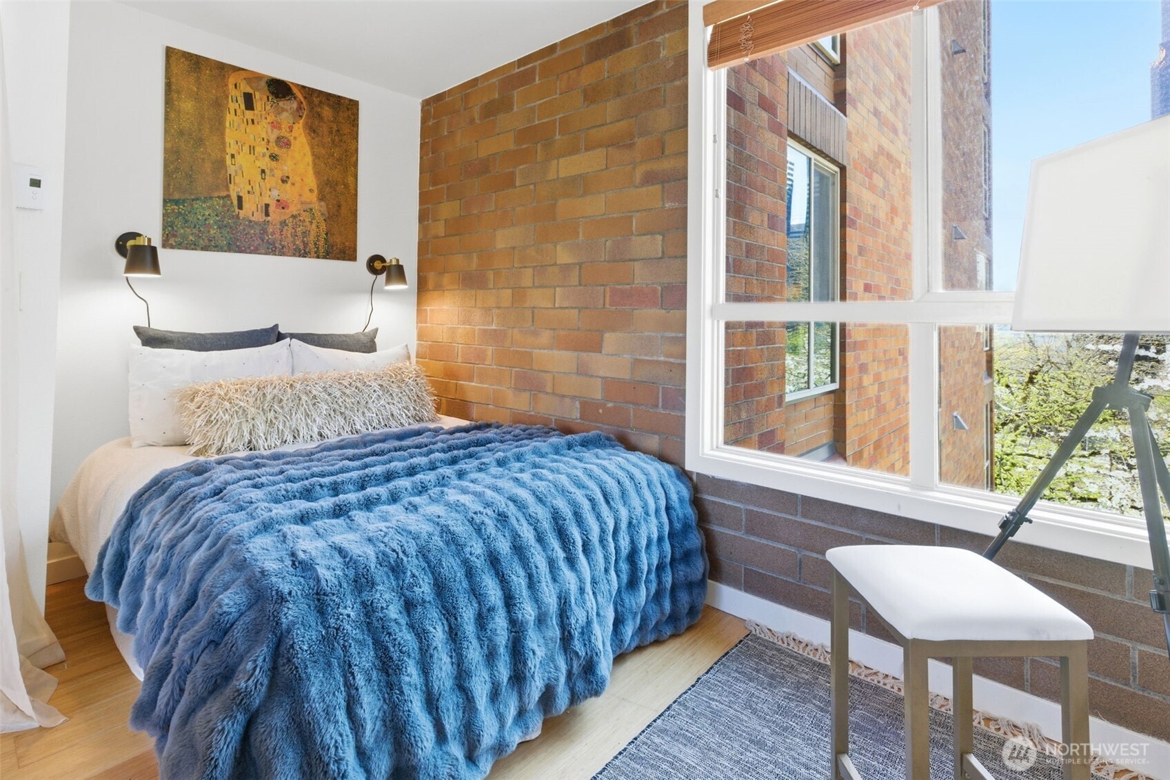 905 Cherry Street, Unit 306 Seattle, WA 98104 - Photo 11 of 25 a bedroom with a bed and a window